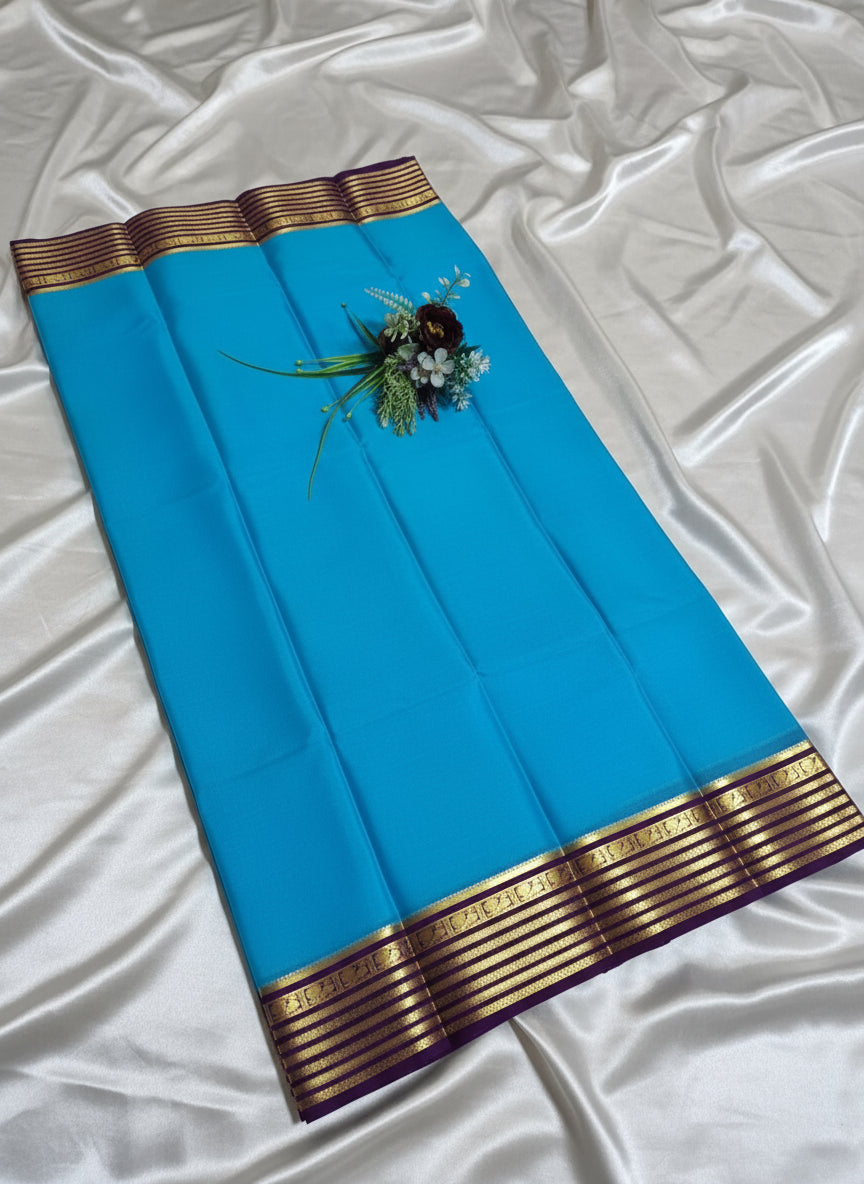 Pure Mysore Crepe Silk - Capri Blue with Purple Peacock Motifs Border