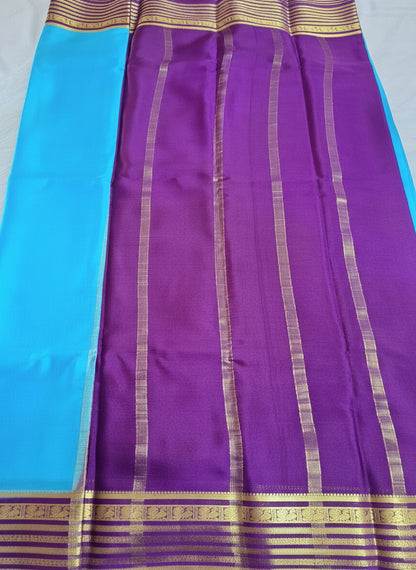 Pure Mysore Crepe Silk - Capri Blue with Purple Peacock Motifs Border