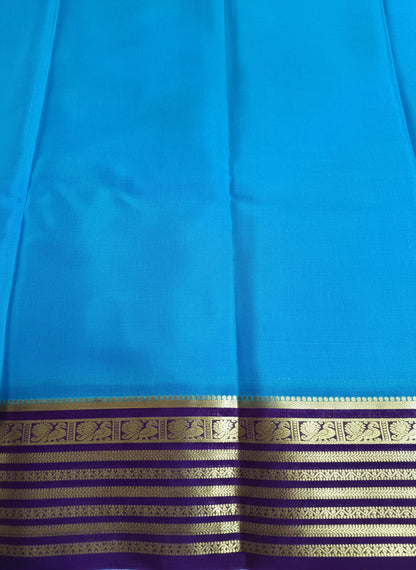 Pure Mysore Crepe Silk - Capri Blue with Purple Peacock Motifs Border