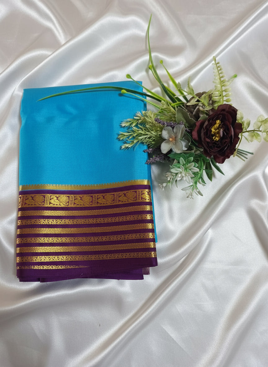 Pure Mysore Crepe Silk - Capri Blue with Purple Peacock Motifs Border