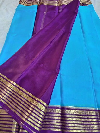Pure Mysore Crepe Silk - Capri Blue with Purple Peacock Motifs Border